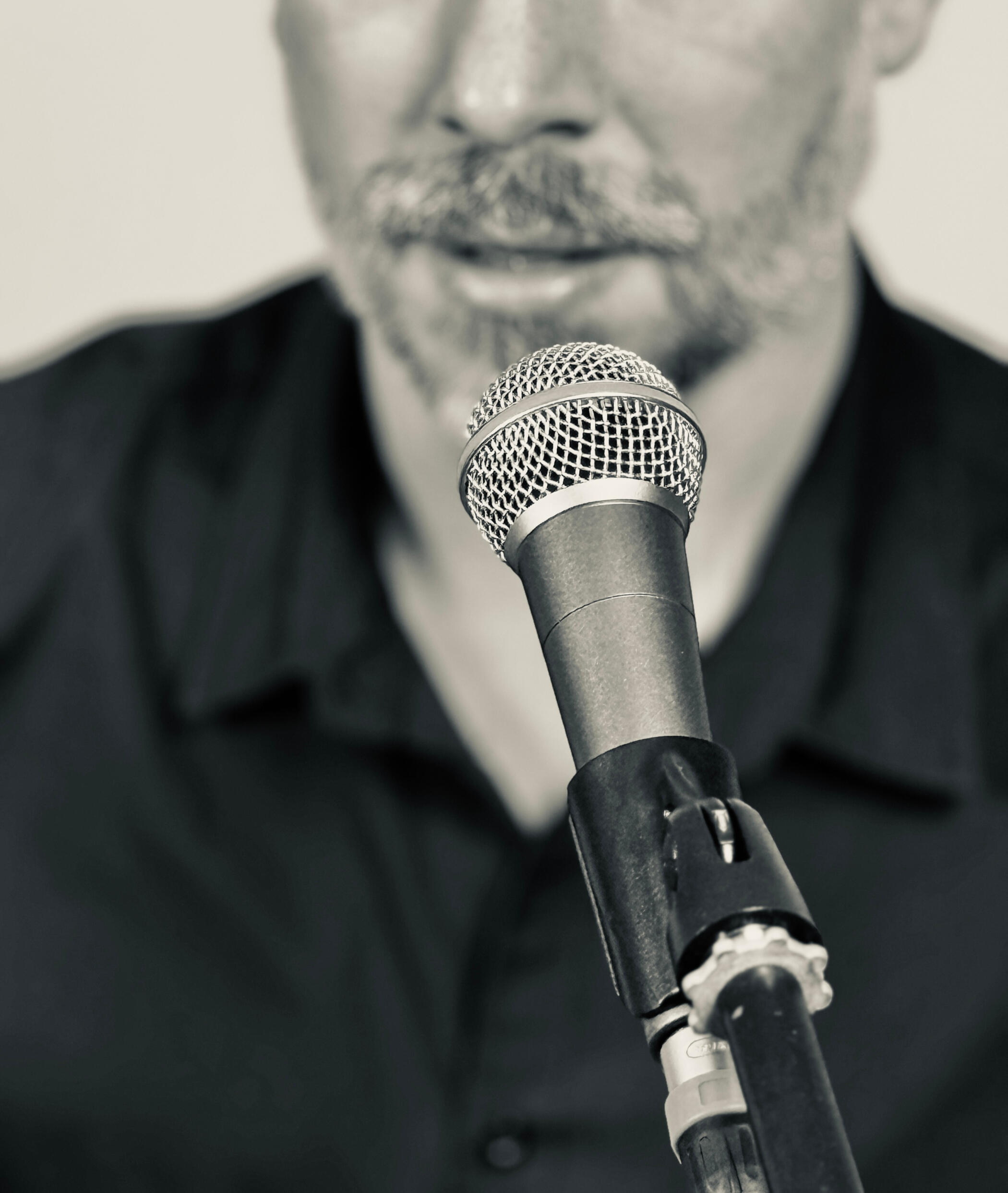 Podcasts Services Microphone in front of a mouth